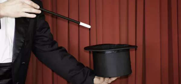 Magician Waves Magic Wand Over A Top Hat