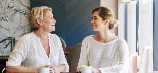 An Older & A Younger Woman Drink Coffee Together