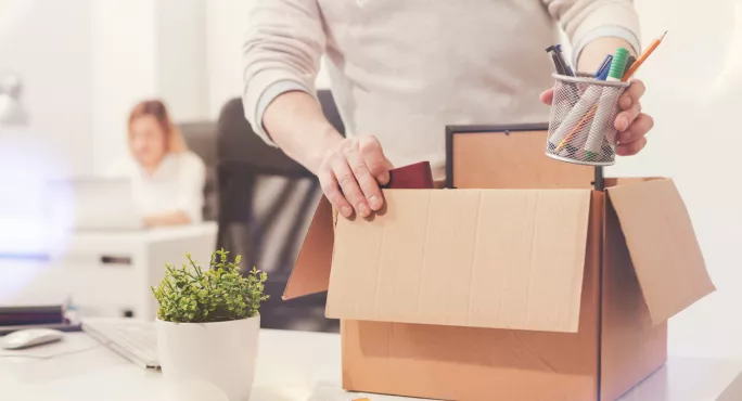 Teacher Packs Belongings Into Box