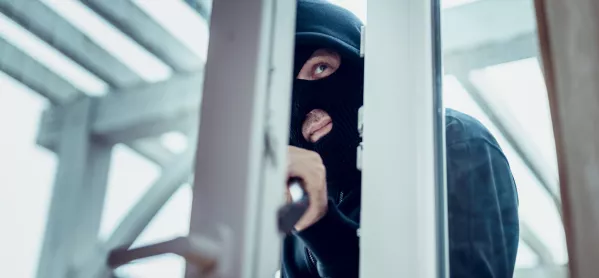A Masked Robber, Crowbarring Open A Door