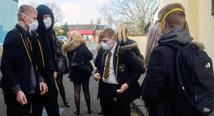 Secondary Pupils In A Playground, All Wearing Masks