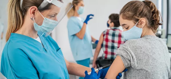 Nurse Vaccinating Young Child