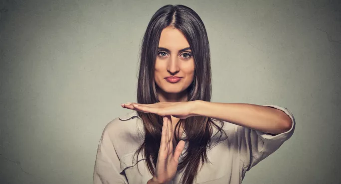 Woman Making "time Out" Sign With Her Hands