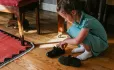Child putting on shoes
