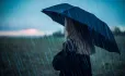 Girl with umbrella in rain