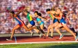 Women sprinters crossing the finish line