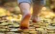 Child walking on coins
