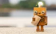 Robot with brown paper bag