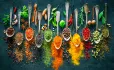 Different spices with spoons