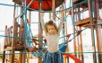 Little girl on rope ladder