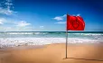 Red flag warning on beach