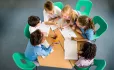 Young school children talking with each other