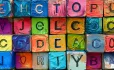 Letters on different coloured blocks