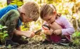 Two children learning about nature