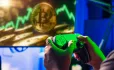 Gamer using controller for on screen financial imagery