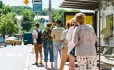 People waiting at a bus stop