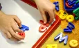 Spelling ia on a child's magnetic board
