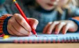 Children holding a pencil