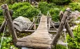 Wooden footbridge across creak