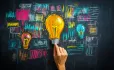 Hand drawn lightbulb on blackboard