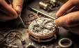 hands fixing watch