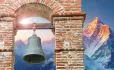 Bell tower with mountain range