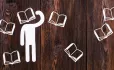 Paper man with book for head