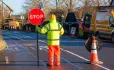 Man holding STOP sign