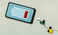 two children plugging in smart phone