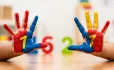 Hands with painted number 7