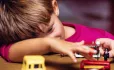 Small boy playing with toys