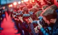 Bank of photographers on red carpet