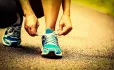 Tying laces on running shoe