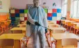 Man In Hazmat Suit Cleans Classroom
