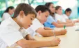 Primary Pupils Sit At Their Desks & Take A Test