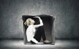 Woman, Squeezed Into Cardboard Box